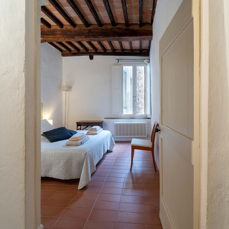 Le Loggine del Pignatello Apartment, Siena City: Bedroom